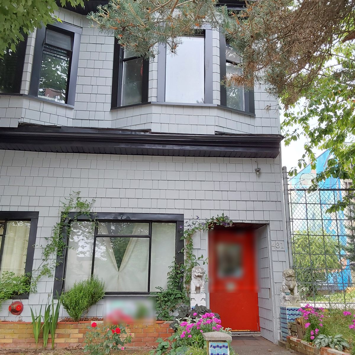 Character heritage building with red door and front garden, Vancouver