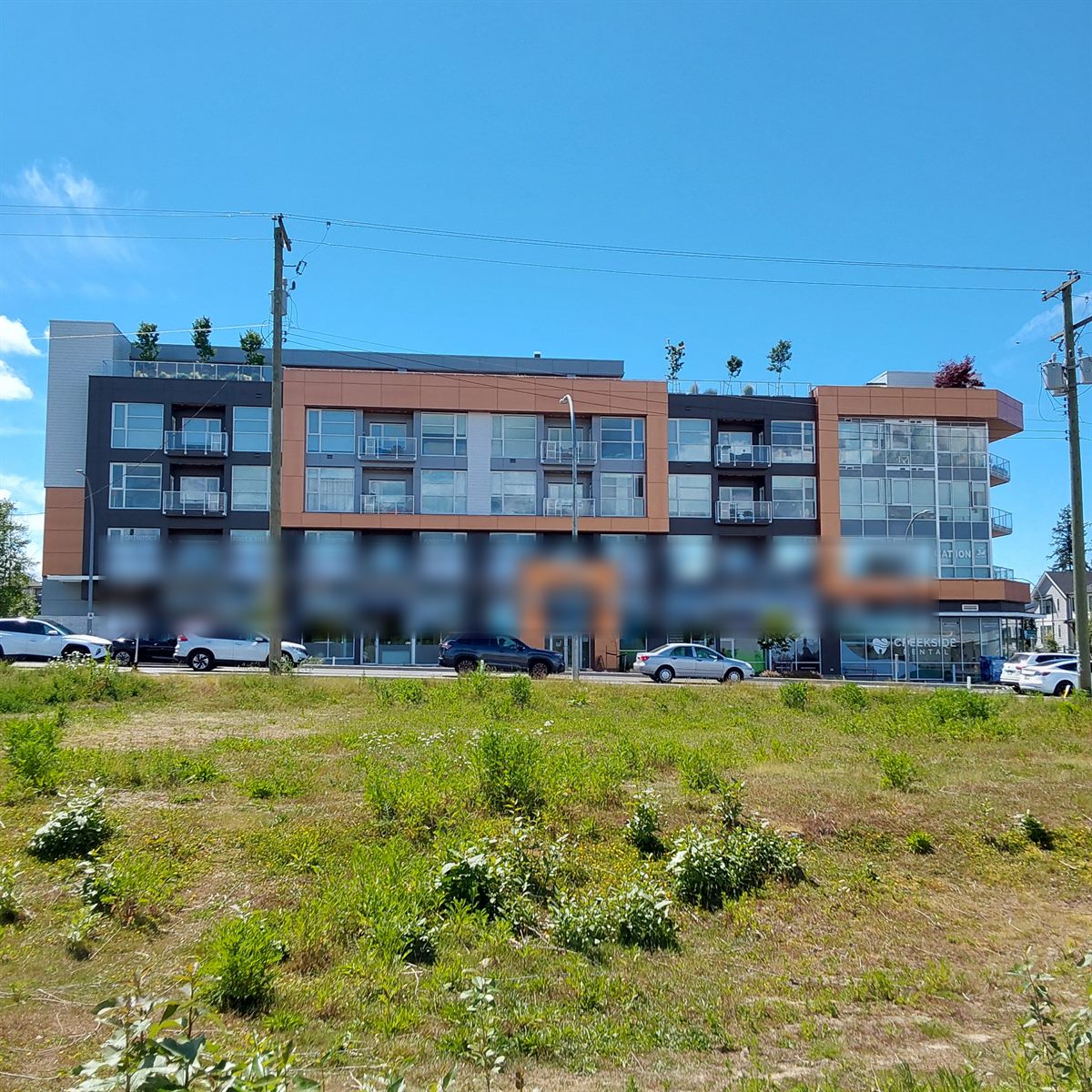 Four-storey mixed-use building with ground-floor retail, Langley